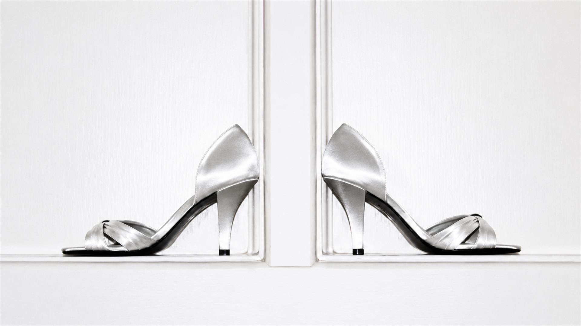 Wedding shoes photographed against a bright white background