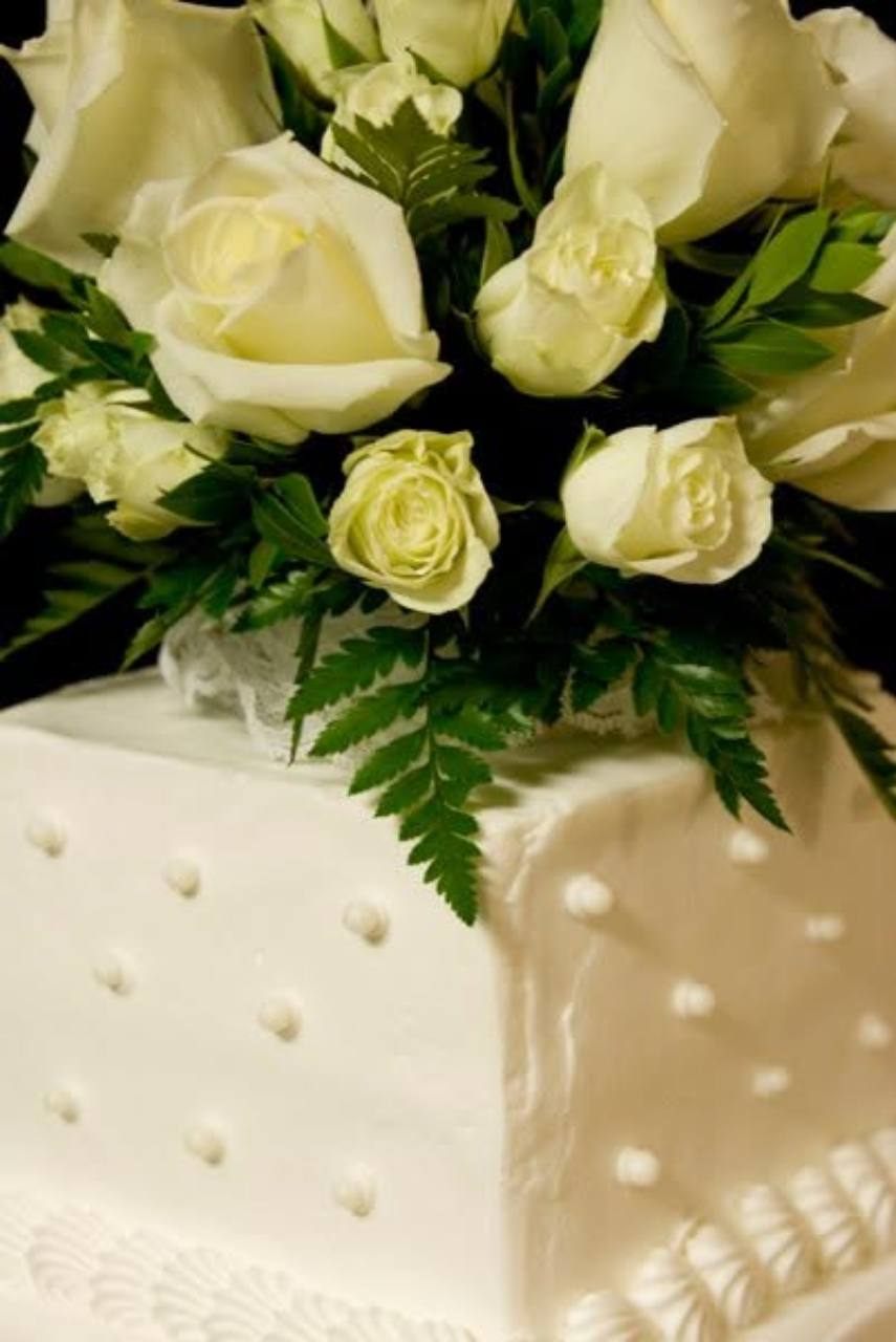 Wedding cake detail with white roses