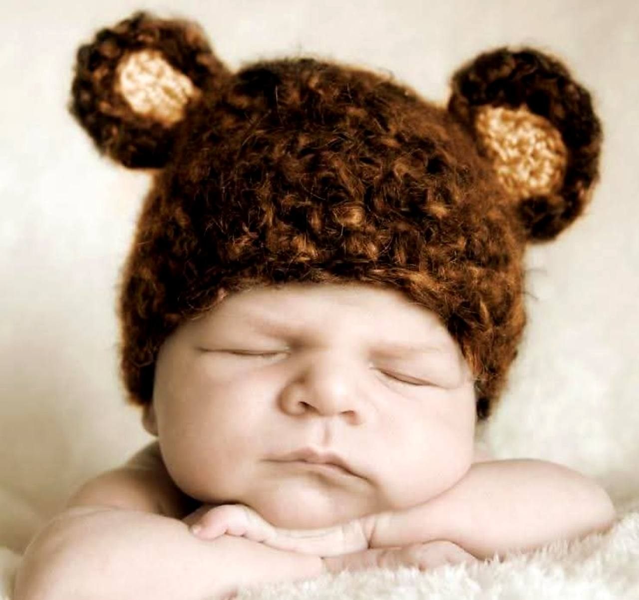 Sleeping newborn portrait with bear hat